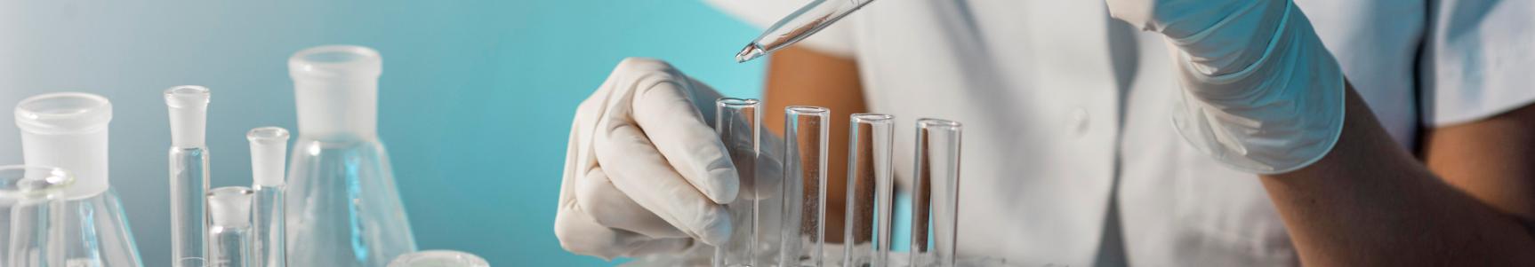 close-up-scientist-holding-tube-pipette.jpg